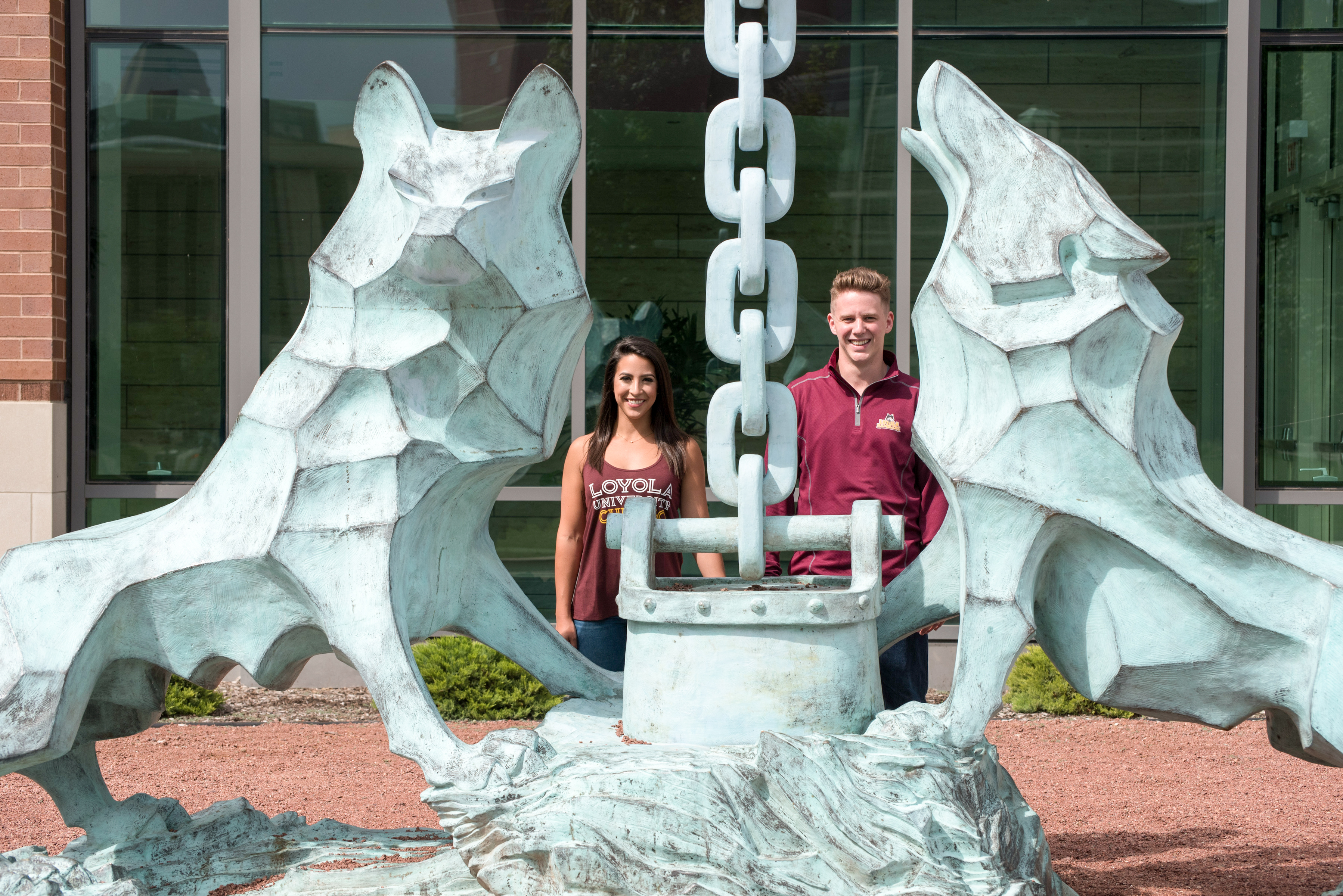 Lisa Lanigan, with husband Parker, at the Wolf and Kettle statue on the Lake ShoreCampus
